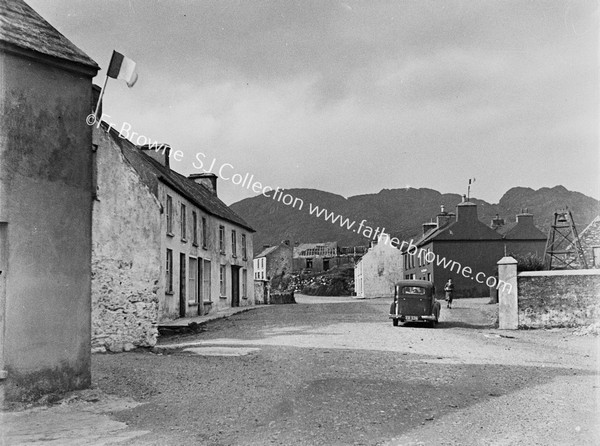 THE VILLAGE TRICOLOUR FALGS INDICATE IRISH SPEAKING HOUSES